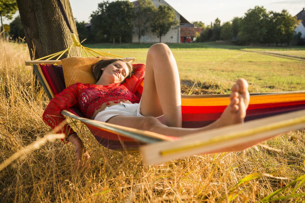 Woman relaxing in a hammock