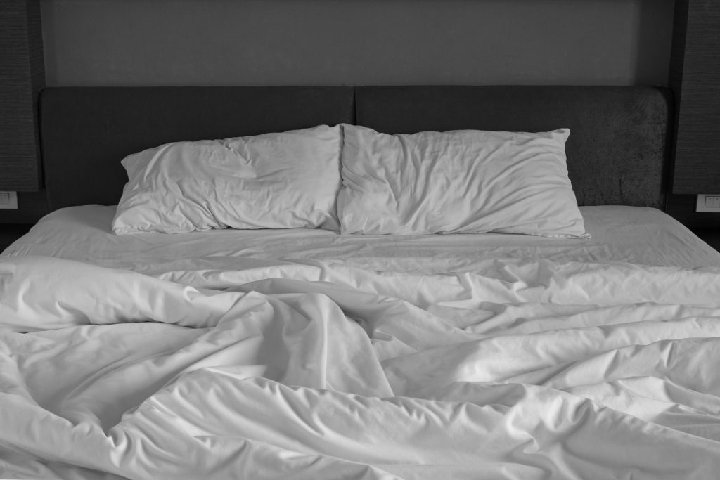 Messy bed sheets and pillow